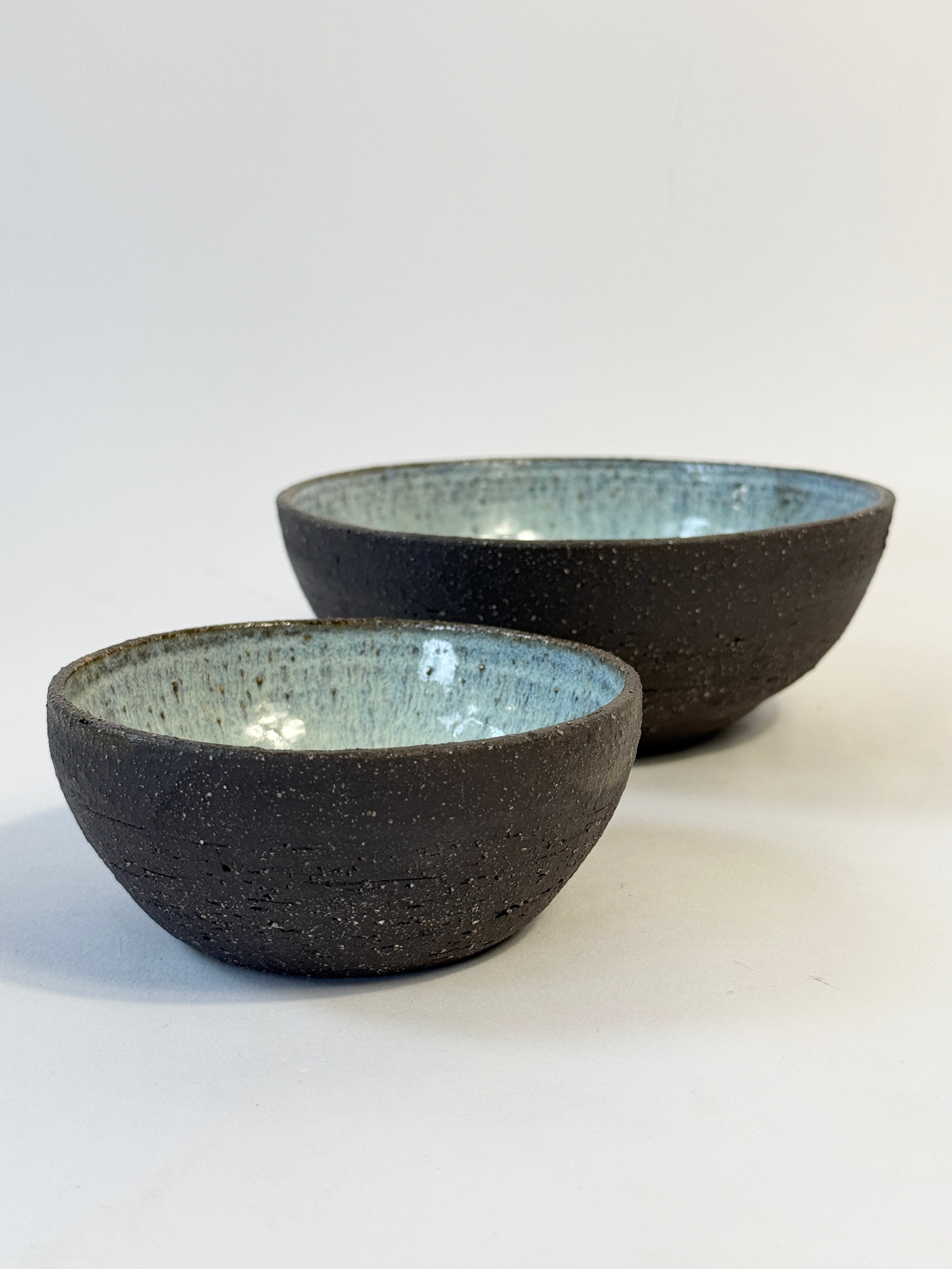 Hand made blue pearl interior bowl set with natural gritty dark clay exterior. Created in Adelaide by FionaK