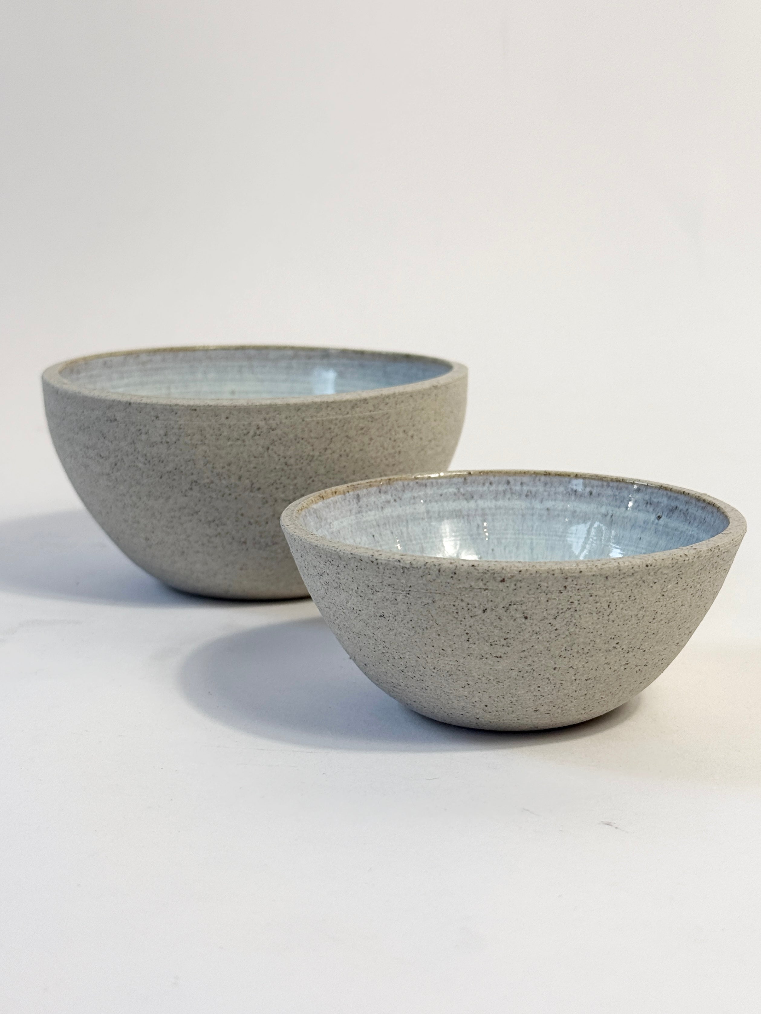 Hand crafted unique ceramic light blue bowls with natural unglazed exterior - FionaK