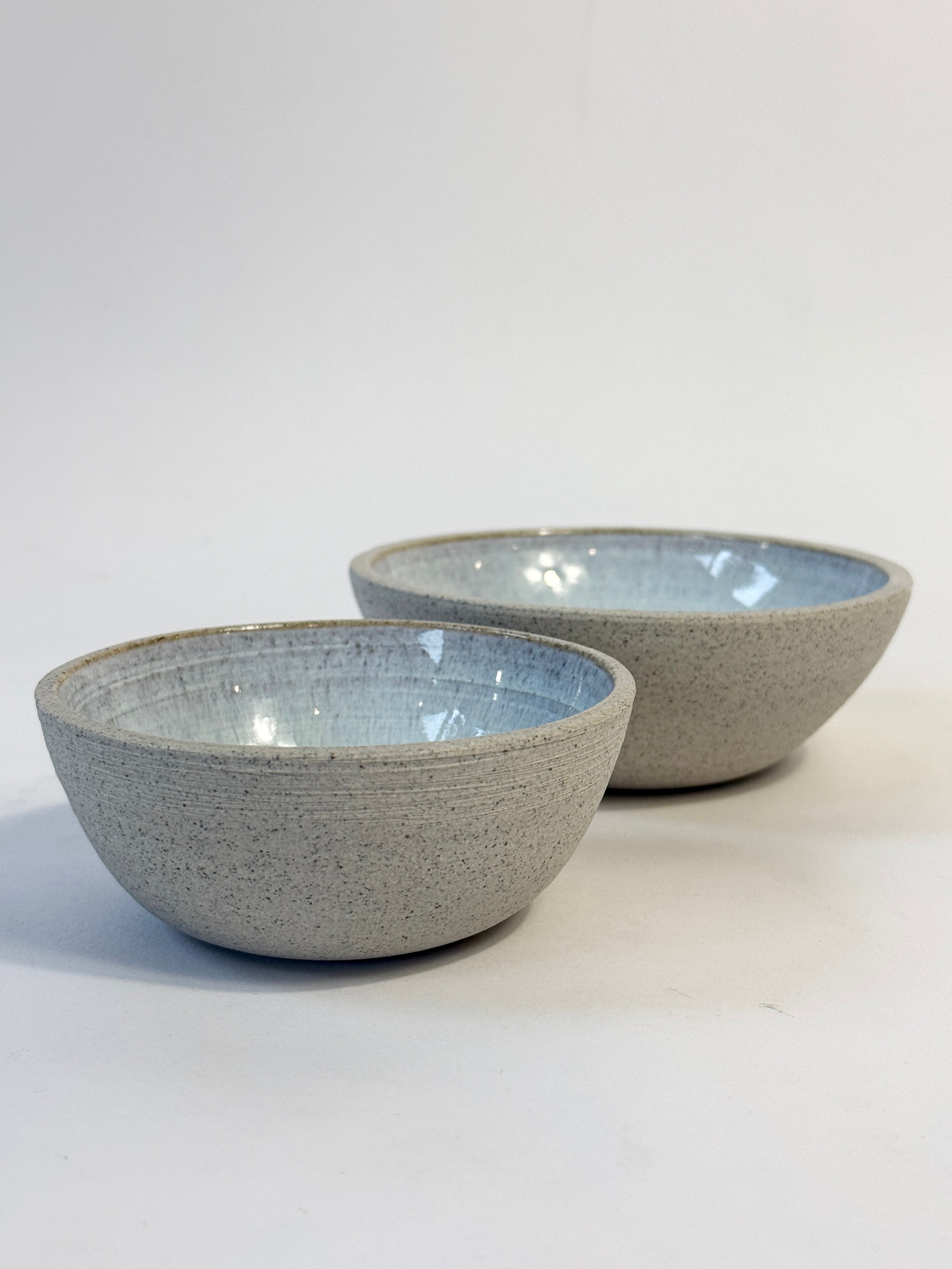 Unique hand crafted ceramic olive bowls with natural speckled exterior