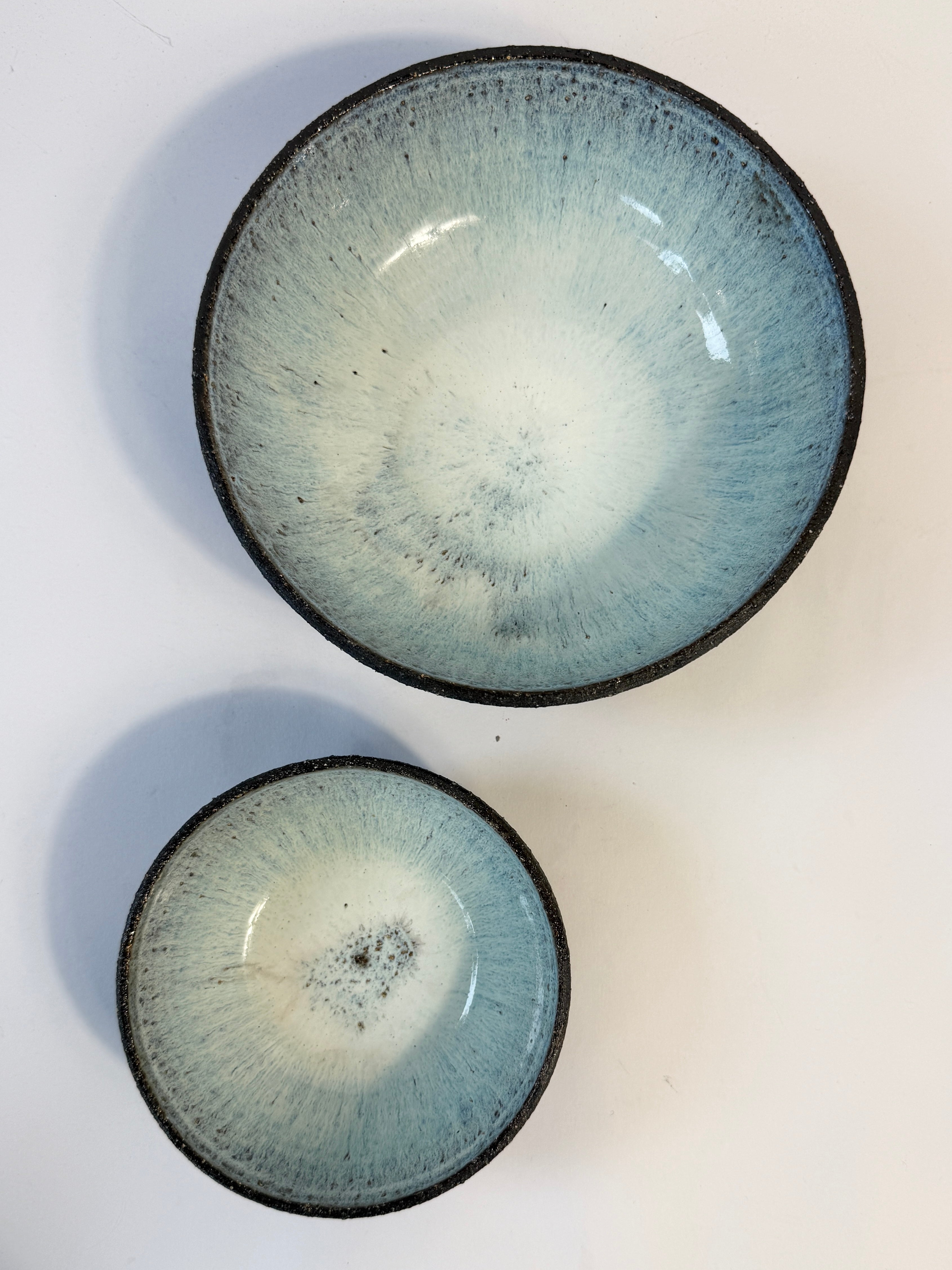 Unique bowls created in Adelaide by 
FioinaK.  Pearl light blue glaze interior and natural unglazed exterior.