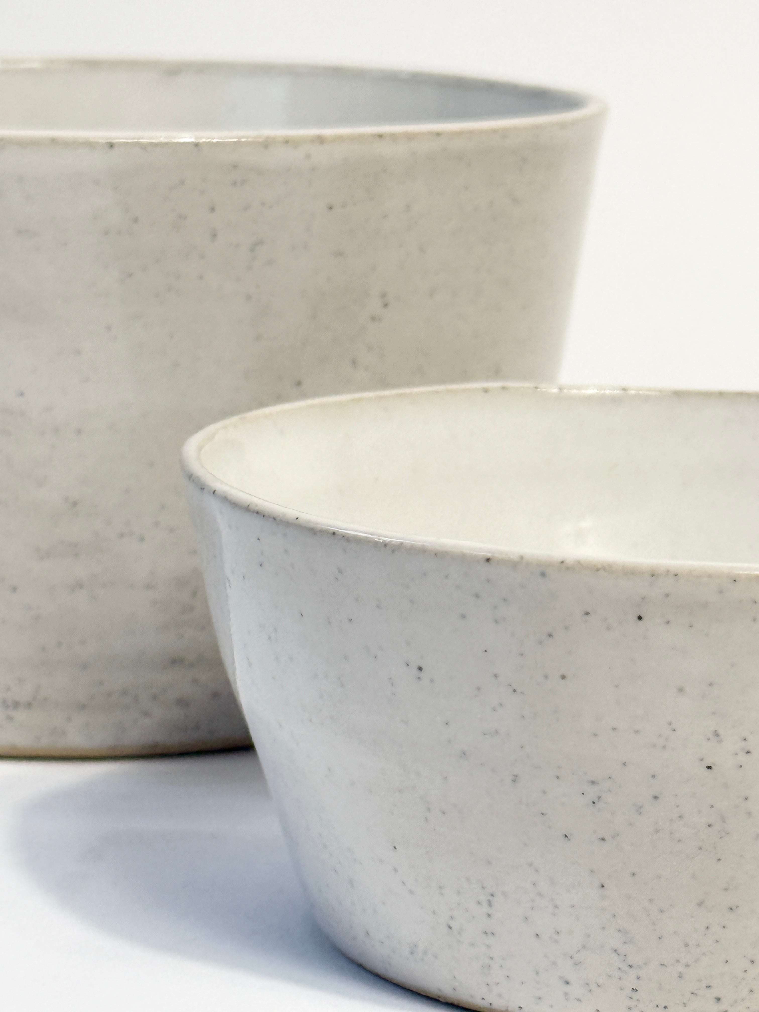 Two handmade ceramic bowls with a speckled white glaze.  Created in Adelaide by FionaK
